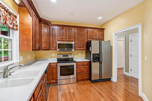 220 Oak Ridge Ln, Ellijay, GA 30536 - kitchen with stainless steel appliances, light wood-type flooring, light countertops, and recessed lighting