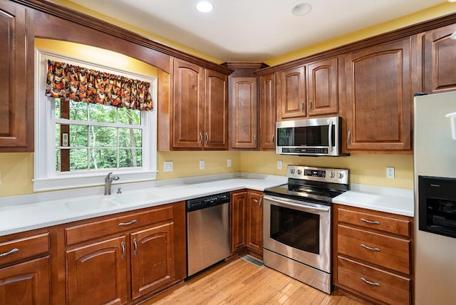 220 Oak Ridge Ln, Ellijay, GA 30536 - kitchen with stainless steel appliances, light wood-type flooring, light countertops, and recessed lighting