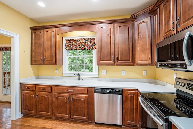 220 Oak Ridge Ln, Ellijay, GA 30536 - kitchen featuring appliances with stainless steel finishes, light wood-style floors, light countertops, and recessed lighting