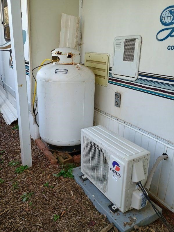 4334 River Bank Run, Hiawassee, GA 30546 - exterior view of ac unit, propane tank, and stucco siding