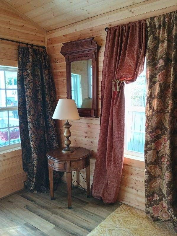 4334 River Bank Run, Hiawassee, GA 30546 - living area with wooden walls, lofted ceiling, wood finished floors, and wood ceiling