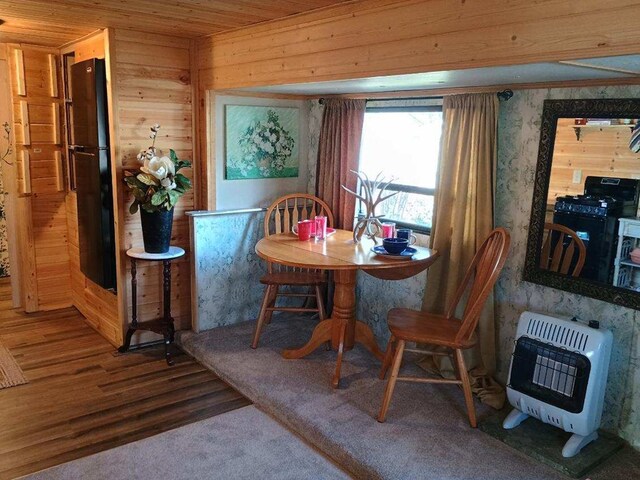 4334 River Bank Run, Hiawassee, GA 30546 - dining space featuring heating unit, wood finished floors, wooden ceiling, and wood walls