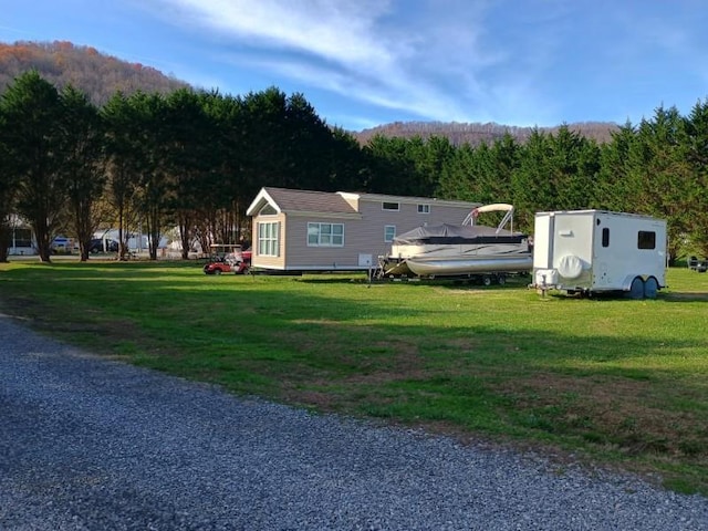 4334 River Bank Run, Hiawassee, GA 30546 - view of front of property with a front lawn and a view of trees