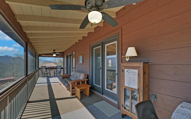 exterior space with a ceiling fan