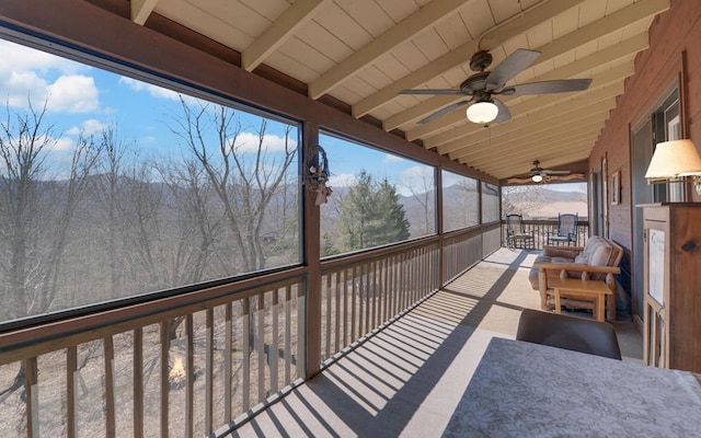 exterior space with outdoor dining area and ceiling fan