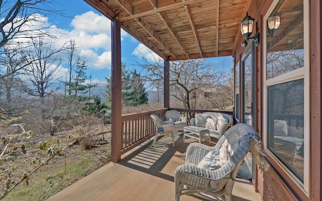 wooden deck with an outdoor hangout area