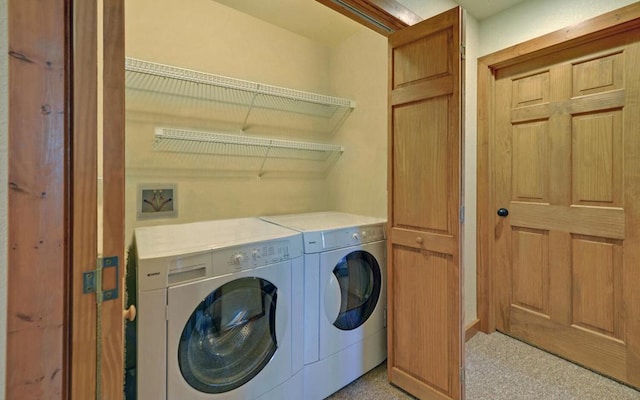 washroom with washer and dryer and laundry area