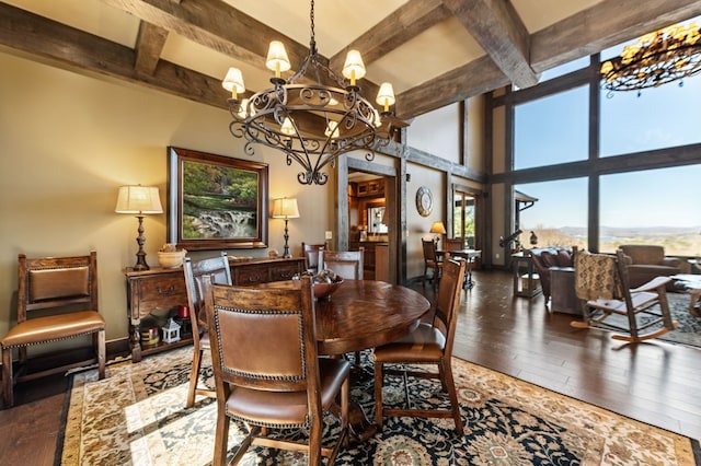 dining space with baseboards, beamed ceiling, hardwood / wood-style floors, a high ceiling, and a notable chandelier