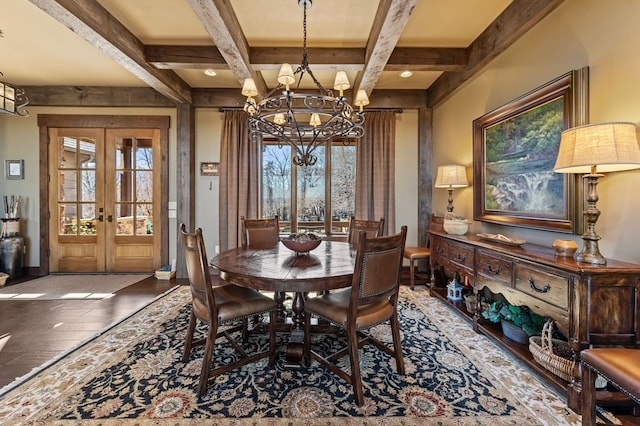 dining room featuring french doors, wood-type flooring, a healthy amount of sunlight, and a chandelier