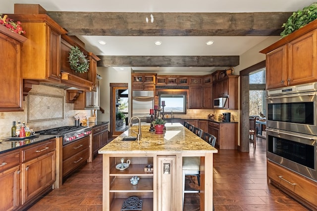 kitchen with a sink, open shelves, plenty of natural light, and stainless steel appliances