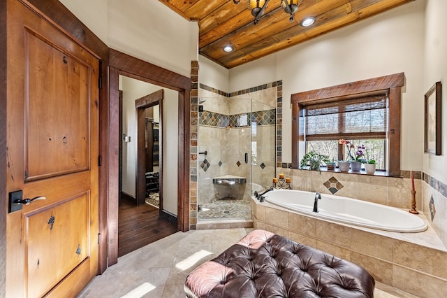 bathroom featuring a garden tub, a stall shower, and wooden ceiling