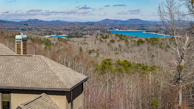 drone / aerial view with a water and mountain view