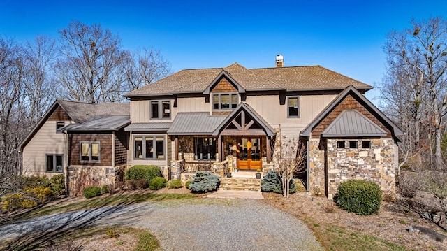 view of front of home with a porch, stone siding, roof with shingles, and a chimney