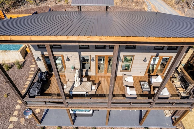 rear view of property with metal roof