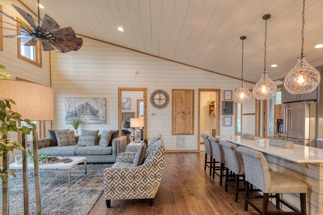 living room with wooden ceiling, vaulted ceiling, wood walls, and dark wood-type flooring