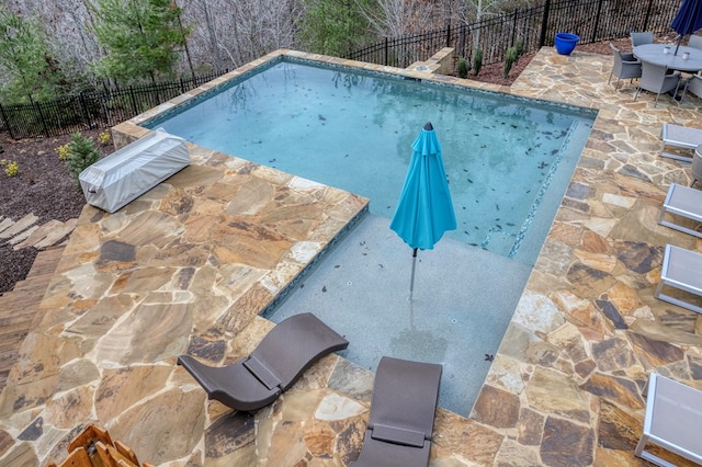 view of pool with fence, a fenced in pool, and a patio