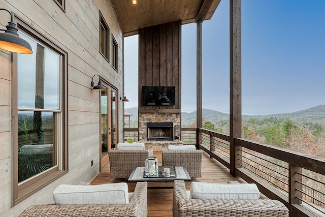 exterior space featuring an outdoor living space with a fireplace