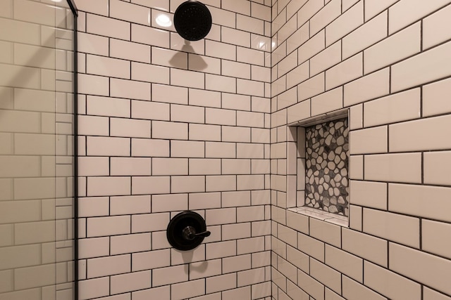 full bathroom with a tile shower
