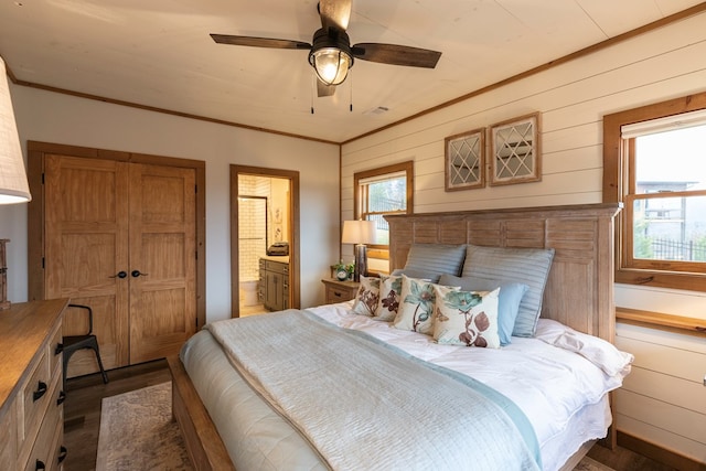 bedroom featuring ornamental molding and multiple windows