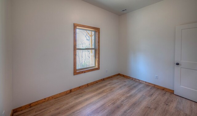 unfurnished bedroom with ceiling fan and light hardwood / wood-style floors