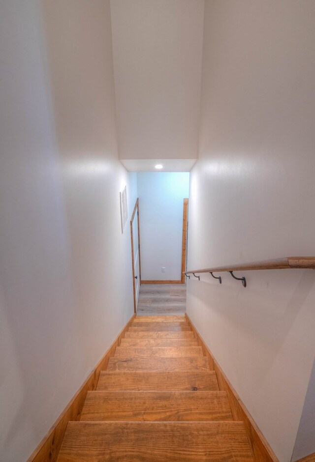 staircase featuring hardwood / wood-style floors