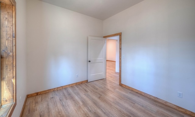 unfurnished room featuring light wood-type flooring