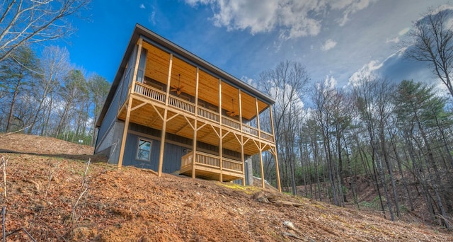 back of house featuring a balcony