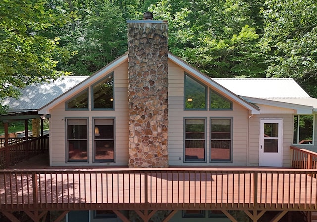 8300 Soapstone Creek Cir, Hiawassee, GA 30546 - back of house with a deck, a metal roof, and a chimney