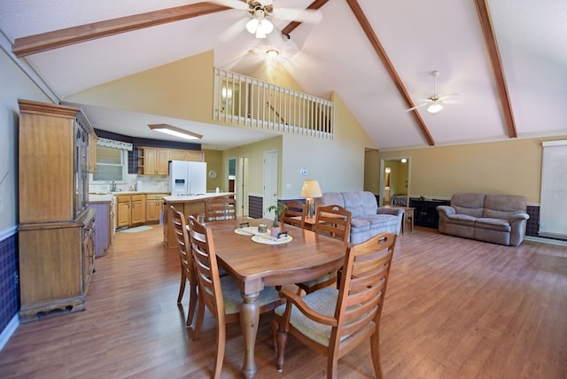 8300 Soapstone Creek Cir, Hiawassee, GA 30546 - dining space featuring a ceiling fan, high vaulted ceiling, light wood-style floors, and beam ceiling