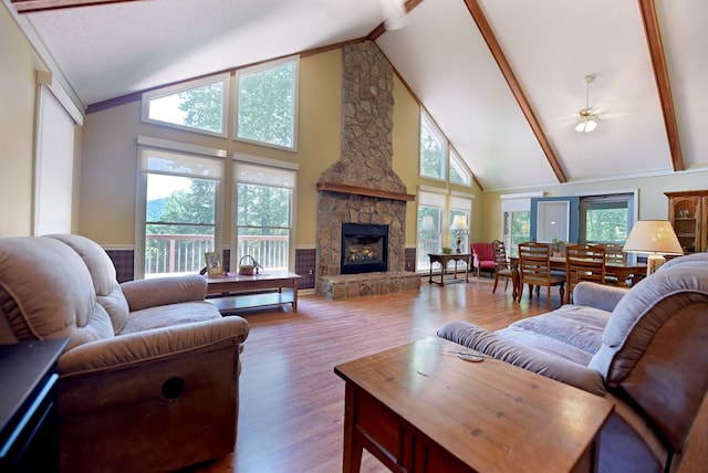8300 Soapstone Creek Cir, Hiawassee, GA 30546 - living area featuring a fireplace, high vaulted ceiling, wood finished floors, and beam ceiling