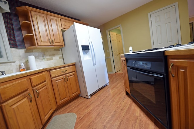 8300 Soapstone Creek Cir, Hiawassee, GA 30546 - kitchen with black electric range oven, white fridge with ice dispenser, light wood finished floors, and light countertops