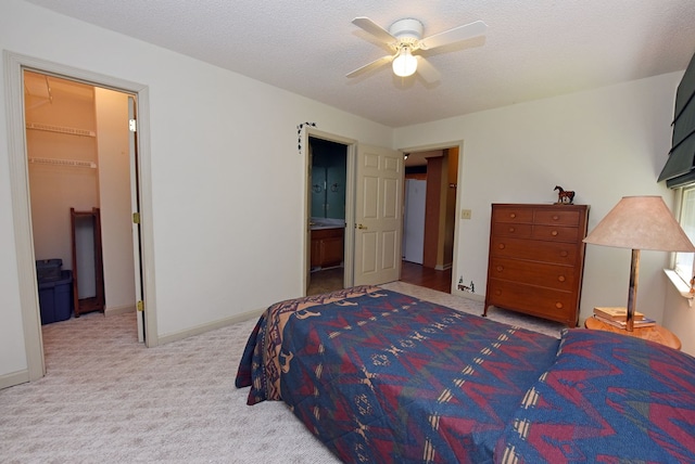 8300 Soapstone Creek Cir, Hiawassee, GA 30546 - carpeted bedroom with a spacious closet, ensuite bathroom, and a ceiling fan