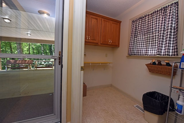 8300 Soapstone Creek Cir, Hiawassee, GA 30546 - laundry area with light floors and baseboards