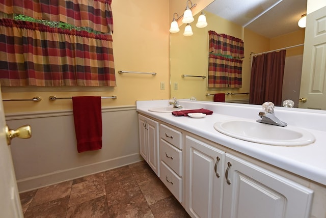 8300 Soapstone Creek Cir, Hiawassee, GA 30546 - bathroom with double vanity, stone finish floors, and curtained shower