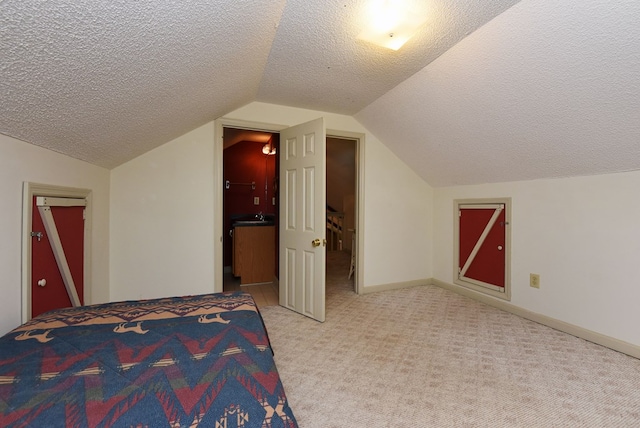 8300 Soapstone Creek Cir, Hiawassee, GA 30546 - unfurnished bedroom featuring a textured ceiling, vaulted ceiling, and carpet floors