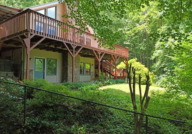 8300 Soapstone Creek Cir, Hiawassee, GA 30546 - rear view of house featuring a deck, stairs, and stone siding