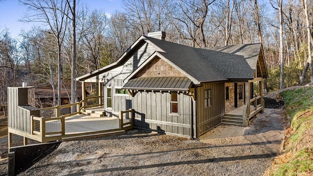 view of property exterior featuring a deck