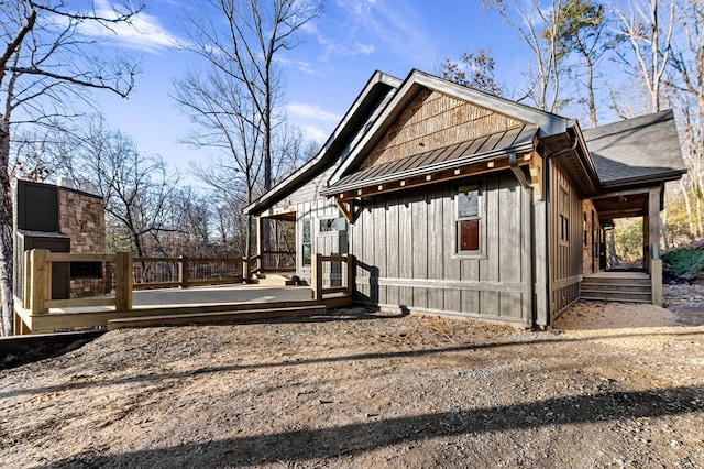 view of side of home with a fireplace