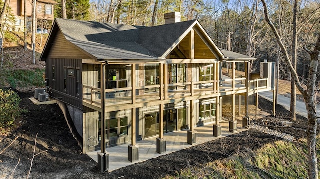 exterior space with central AC unit and a patio area