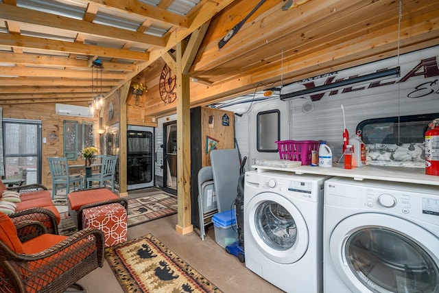 laundry room featuring a wall mounted air conditioner, separate washer and dryer, and wooden walls