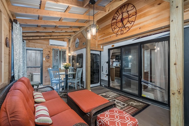 interior space with a wall mounted air conditioner, lofted ceiling with beams, and wood walls