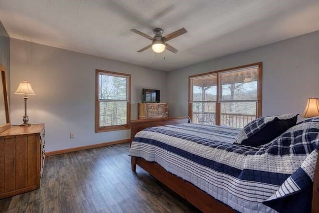 bedroom with a ceiling fan, baseboards, and wood finished floors