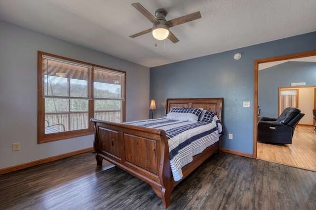 bedroom with a ceiling fan, baseboards, and wood finished floors