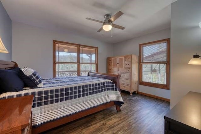 bedroom with wood finished floors, a ceiling fan, and baseboards