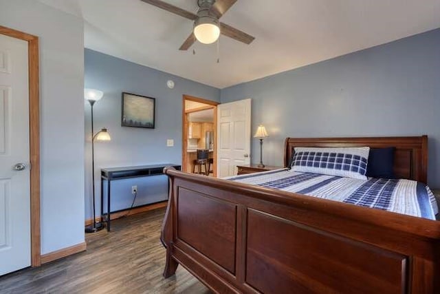 bedroom featuring ceiling fan, baseboards, and wood finished floors