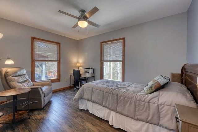 bedroom with a ceiling fan, baseboards, and wood finished floors