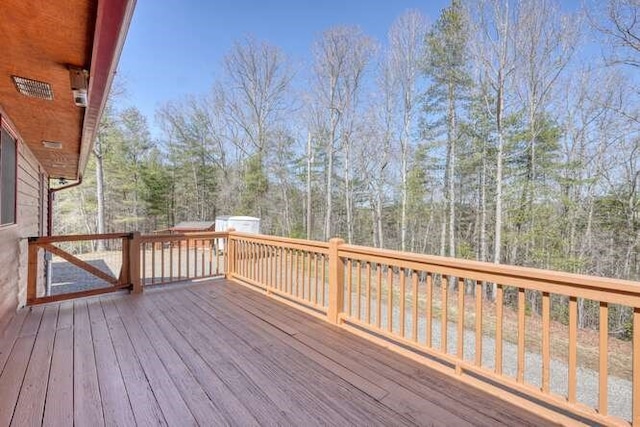 wooden deck with an outdoor structure