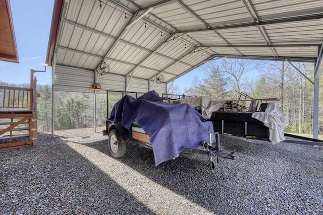 view of parking / parking lot featuring a carport