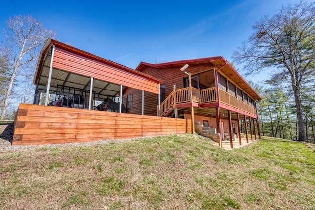 back of house with a patio and a yard