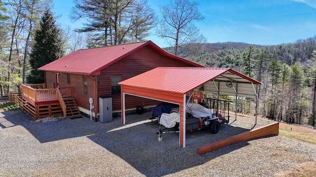 view of outdoor structure with a forest view